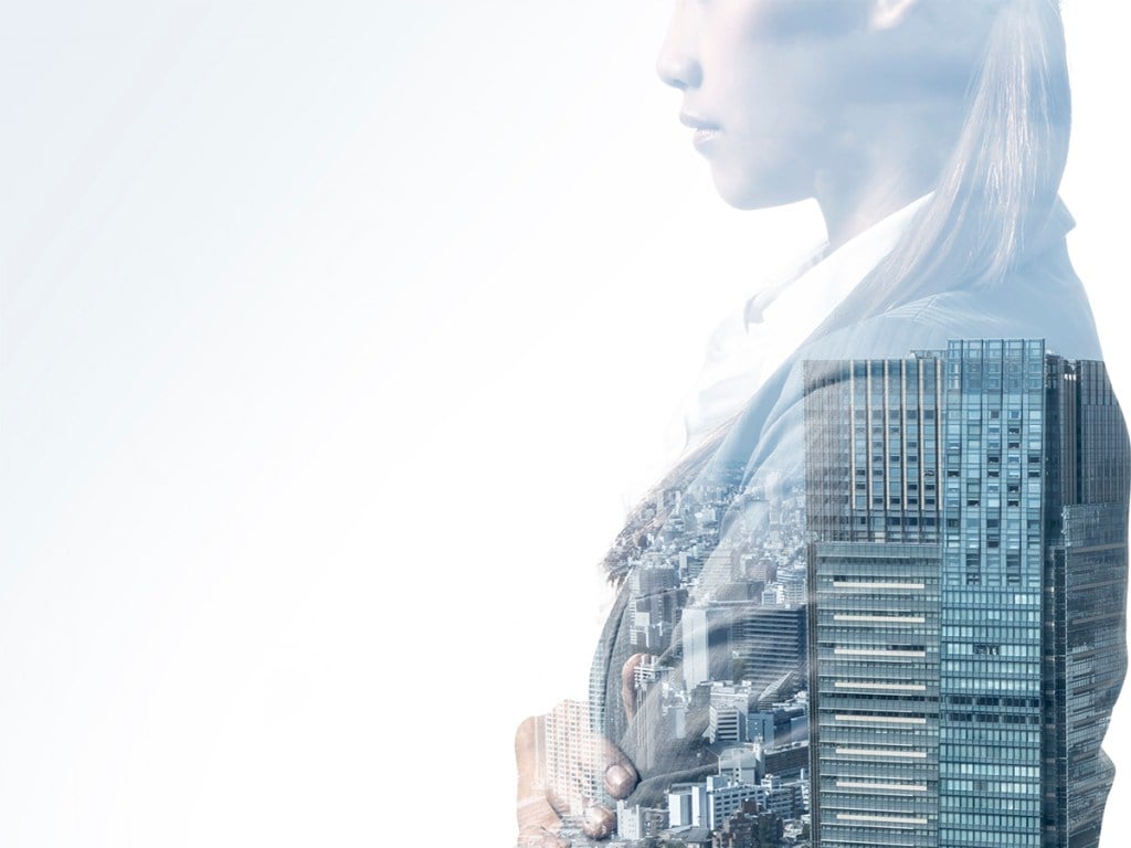 double exposure of business woman and modern building