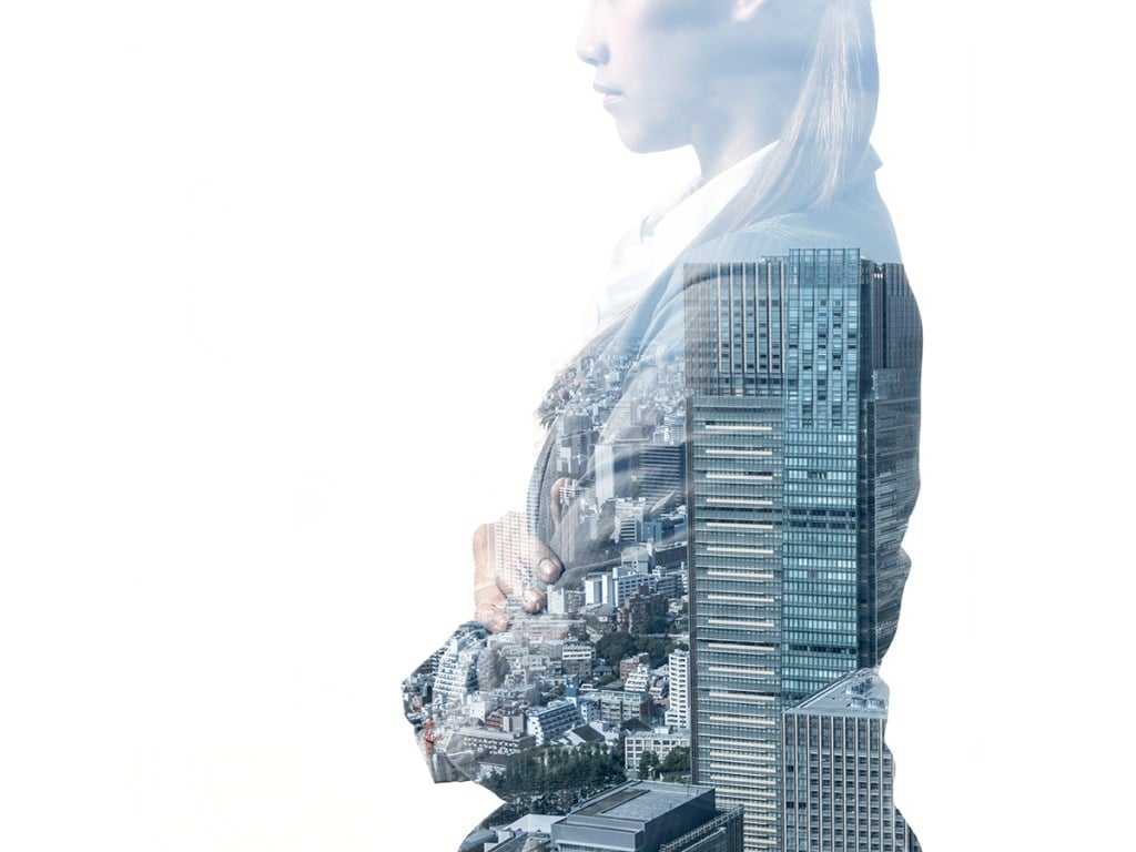 double exposure of business woman and modern building