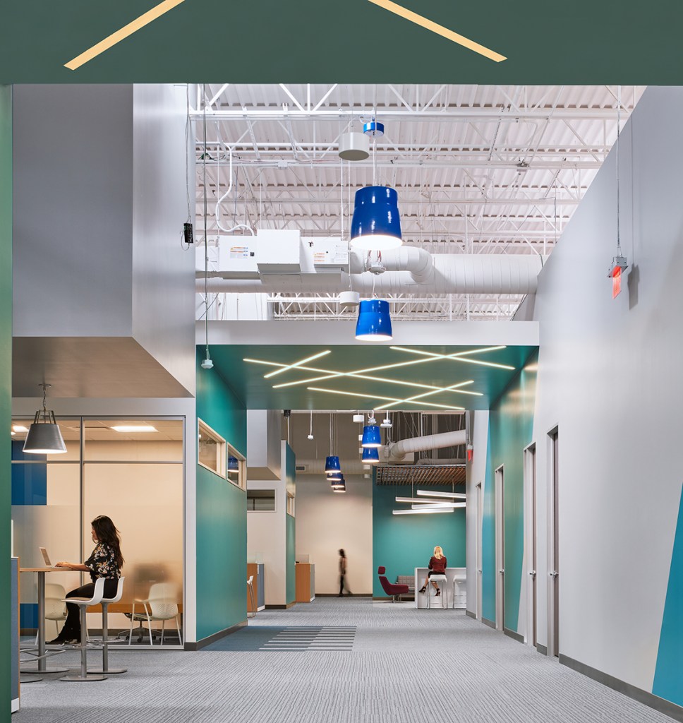 The site chosen for this Austin, Texas, lab project designed by Method Architecture was a leased portion of a former big box retail building. The design team used the tall clear height space for the lab functions and highlighted the same 25-foot roof deck to bring skylit volume to the office, meeting and circulation spaces. Image courtesy of Method Architecture