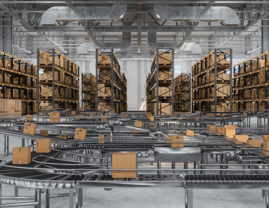 Image of warehouse floor with packages shelves and conveyor belts.