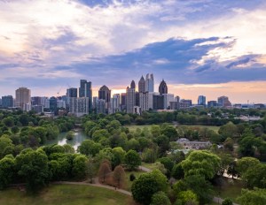 dramatic sunset over Atlanta skyline with park on a beautiful day