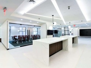 Interior shot of a coworking space model, showing the reception and a larger conference room.