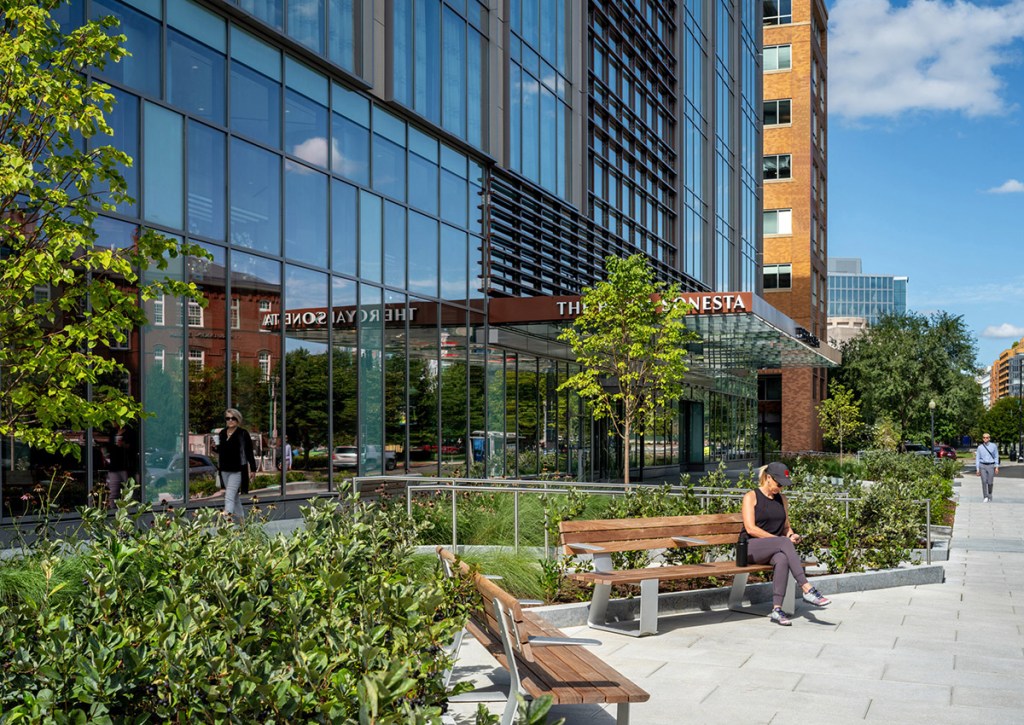 The entrance at 20 Mass, with trees and plants