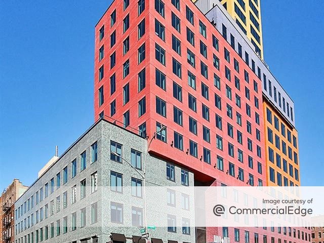 Aerial shot of Radio Tower, a 305,000-square foot mixed-use high-rise in Washington Heights. The building has eight different colors of glazed ceramic brick.