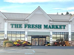 Exterior shot of the Fresh Market that anchors a 120,049-square-foot shopping center in Latham, N.Y.