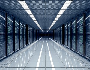 A long hallway lined with rows of servers, showcasing the organized layout of a modern data center.